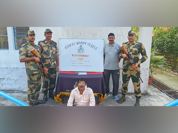 BSF troops with the apprehended smuggler (Pic: BSF)