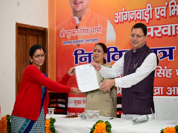 Uttarakhand CM distributing appointment letters to Anganwadi workers (Photo/Uttarakhand CM office)