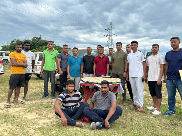 Apprehended accused with suspected heroine in background (Photo/Himanta Biswa Sarma 'X' account)