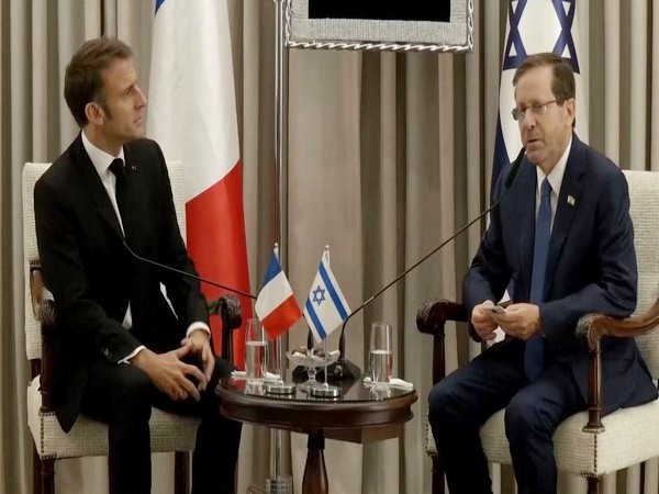 French President Emmanuel Macron with his Israeli counterpart Isaac Herzog in Tel Aviv on Tuesday. (Photo/ANI)