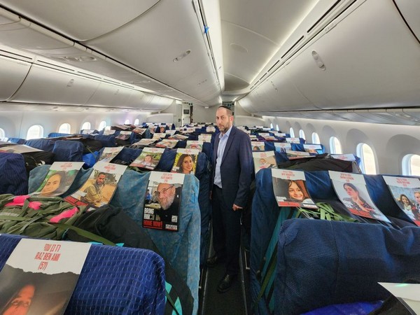 The charter flight, which was delivering medical supplies, placed photos of individual hostages being held by Hamas in Gaza (Photo/TPS)
