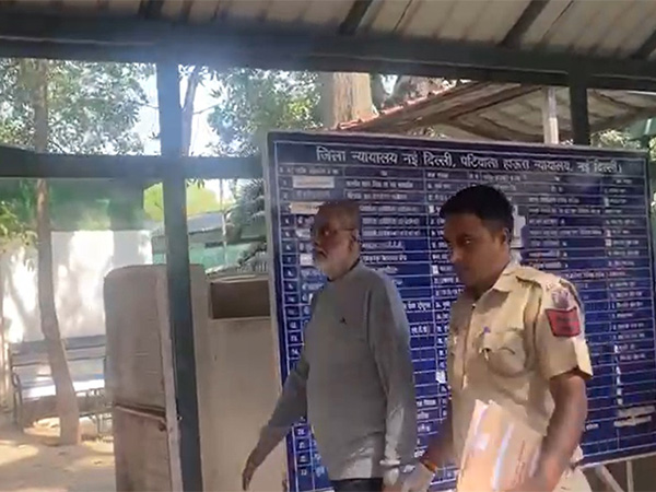 Visuals of Prabir Purkayastha being brought to court