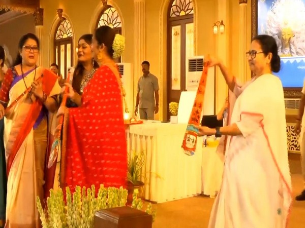 West Bengal Chief Minister Mamata Banerjee dances with an oar (Photo/ANI)