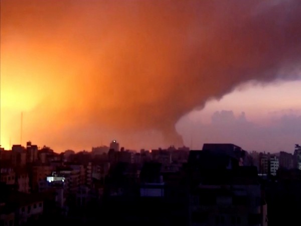 Smoke and flames rise as Israeli air strikes bombard Gaza as seen from Gaza City (Photo Credit: Reuters)