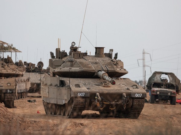 An Israeli tank and military vehicles seen at Gaza border(Photo Credit: Reuters)