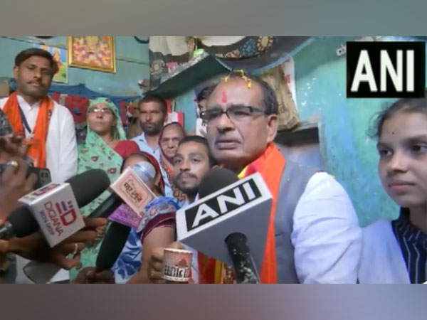 MP CM Chouhan having tea at the house of girl who benefitted from Girl Scooty Scheme (Photo/ANI)