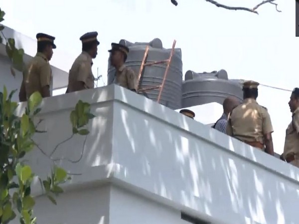 Kerala Police at Dominic Martin's house (Photo/ANI)