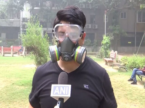 BJP leader Shehzad Poonawalla dons Gas Mask (Photo/ANI)