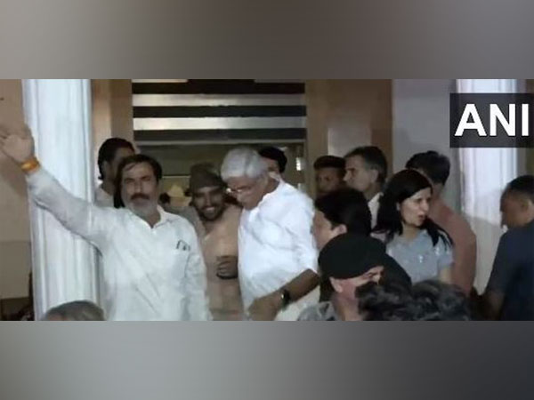 Union Minister Gajendra Singh pacifying supporters protesting after a BJP leader was denied ticket for Rajasthan polls (Photo/ ANI)