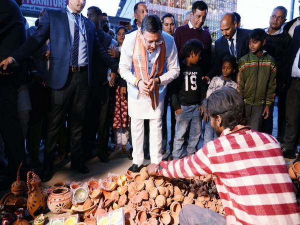 Uttarakhand Chief Minister Pushkar Singh Dhami purchasing earthen lamps (Photo/ANI)