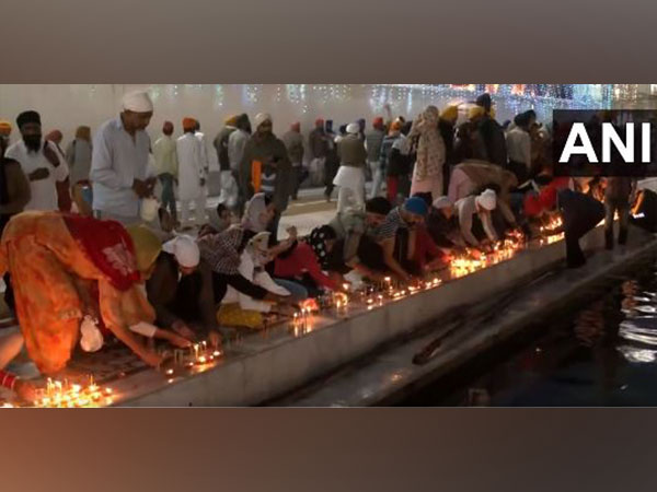 Devotees offer prayers at the Golden Temple in Amritsar on the occasion of Diwali. (Photo/ANI)