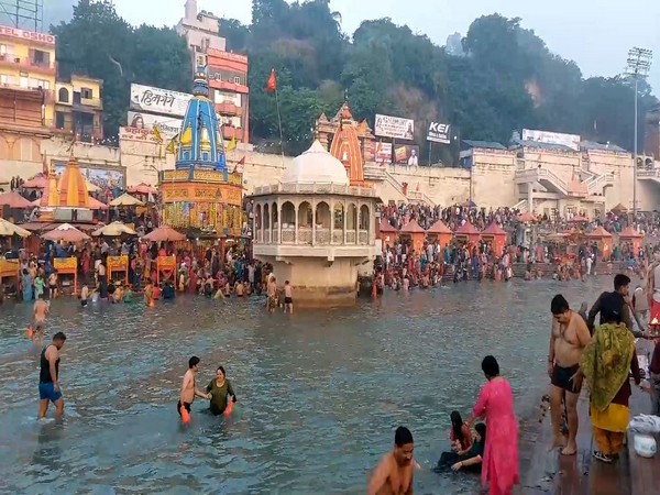 Devotees take holy dip in river Ganga, in Haridwar on the occasion of Somvati Amavasya. (Photo/ANI)