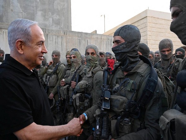 Israeli Prime Minister Benjamin Netanyahu meets with soldiers in Tze'elim (Photo Credit: Reuters)