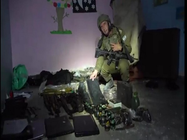 IDF Spokesperson Rear Adm Daniel Hagari walks through one of Hamas' subterranean terrorist tunnels (Photo Credit: IDF)