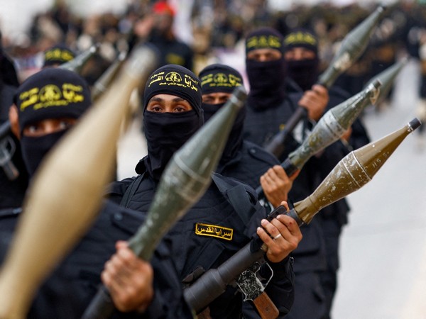Palestinian Islamic Jihad militants participate in an anti-Israel military parade marking the 36th anniversary of the movement's foundation in Gaza City (Photo Credit: Reuters)