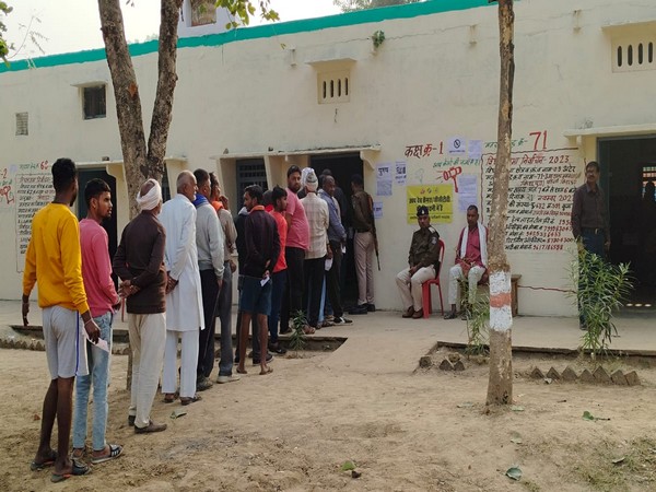 Voters queue up outside polling booth to exercise their franchise (Photo/ANI)