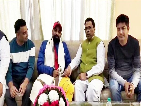 UP Minister Narendra Kashyap and Mohammed Shami. (Picture: ANI)