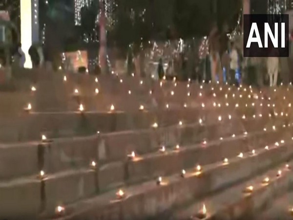 Lamps illuminate Varanasi’s ghats as people celebrate Dev Deepavali. (Photo/ANI)