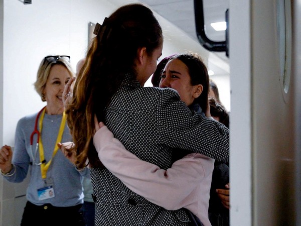 Released hostages reunited with family (Photo Credit: Reuters)  