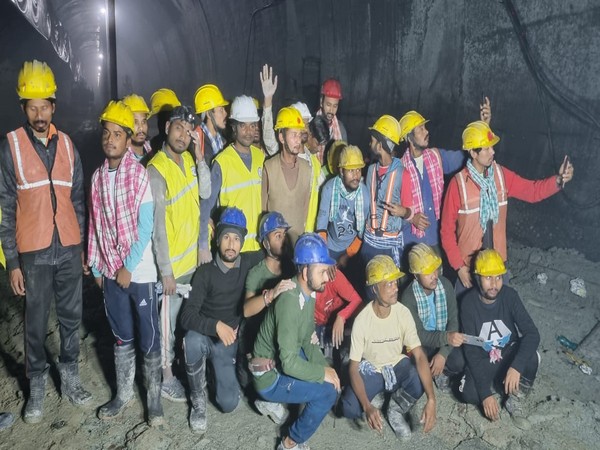 Rescued workers celebrate as they reach safety (Photo/ANI)