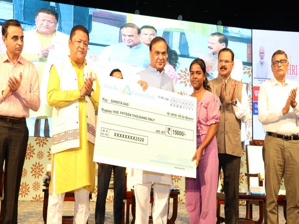 Assam CM presents 'Anundoram Borooah Award' to a meritorious students. (Photo/ANI)