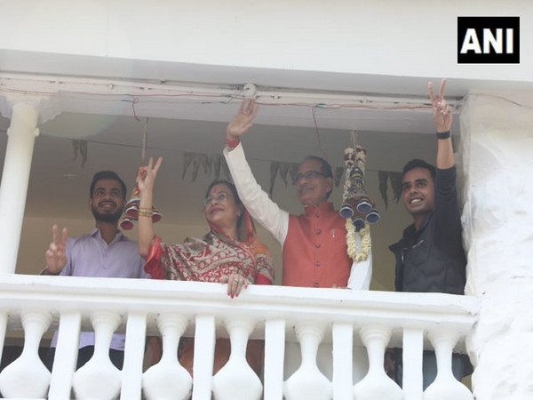 Madhya Pradesh CM Shivraj Singh Chouhan along with his family greets party workers and supporters in Bhopal (Photo/ANI)