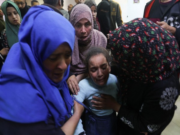 People react as they rush to the hospital following an Israeli strike at Nasser hospital in Khan Younis (Photo Credit: Reuters)
