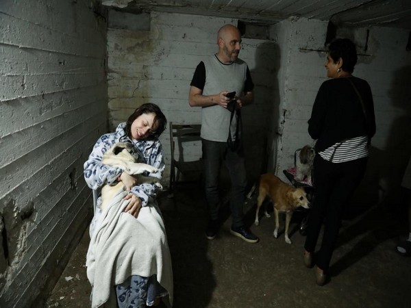 Israelis take cover in a Tel Aviv bomb shelter during a Palestinian rocket barrage (Photo/TPS)