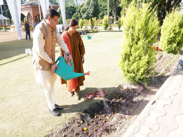 CM Dhami along with his wife Geeta Dhami launches plantation program of 4000 tulip bulbs. (Photo/ANI)