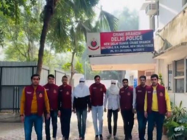 Delhi police officials with 2 shooters (Photo/ANI)