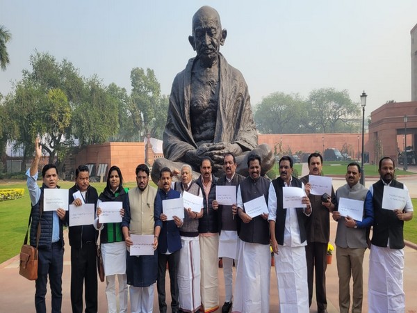 Kerala MPs hold protest in front of Gandhi statue in Parliament. (Photo/ANI)