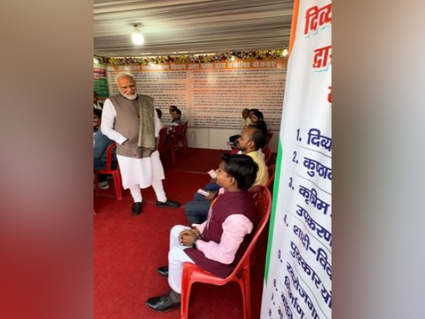 Prime Minister Narendra Modi interacts with beneficiaries at Viksit Bharat Sankalp Yatra in Varanasi. (Photo/ANI)