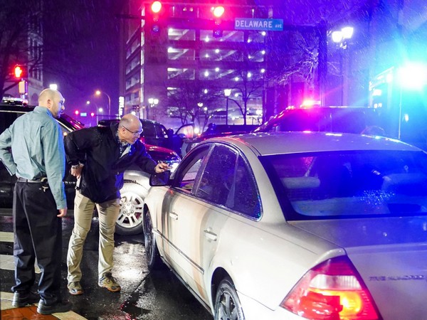 Members of the United States Secret Service react to a vehicle crashing into a Secret Service SUV that was blocking the street, in Wilmington (Photo Credit: Reuters)