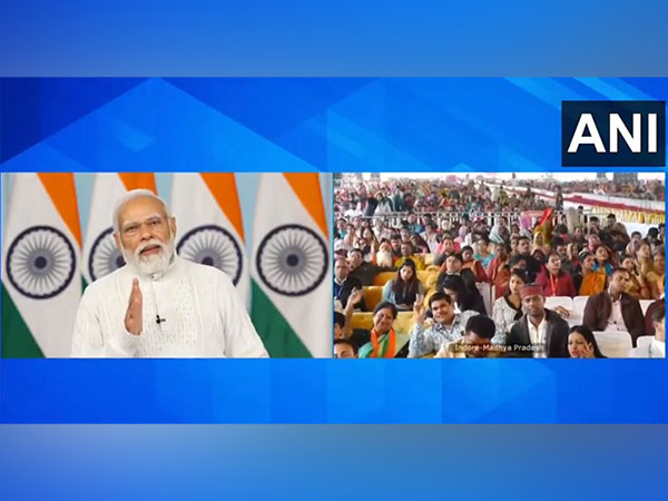 Prime Minister Narendra Modi handing over cheque pertaining to dues of Hukumchand Mill workers in Indore (Image: ANI)