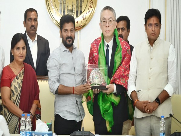 Telangana CM Revanth Reddy with Foxconn's Lee. (Photo/ANI)