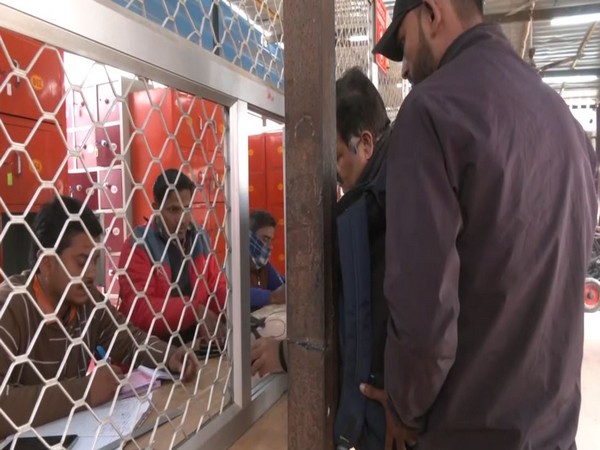 Devotees collecting Aarti passes for Lord Ram Lalla (Photo/ANI)