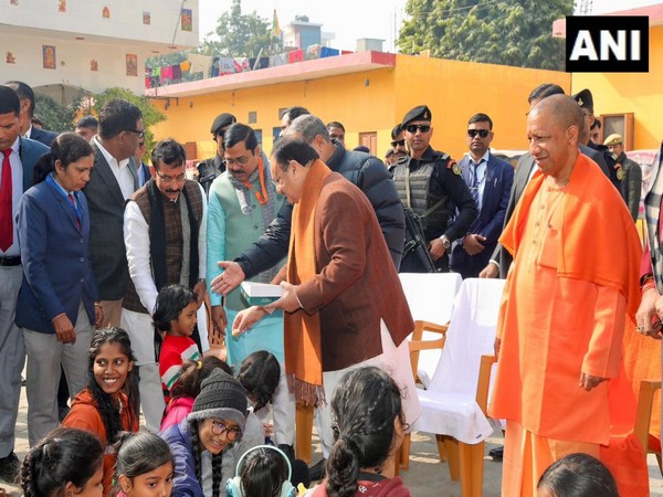 CM Yogi and BJP President Nadda meet children at Leprosy ashram (Photo/ANI)