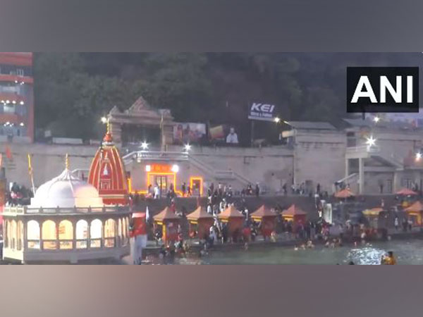 People take a holy dip in River Ganga at Har Ki Pauri (Photo/ANI)