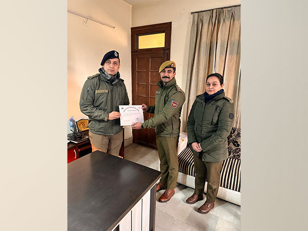 A Jammu cyber police official being rewarded (Photo credit /Jammu police)