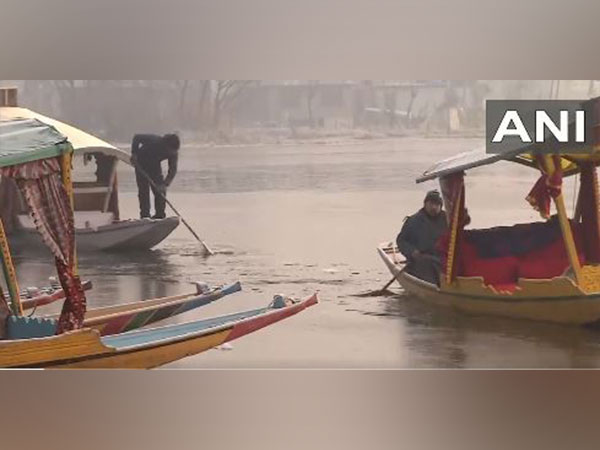 A thin sheet of ice formed on Dal Lake on Sunday. (Photo/ANI)