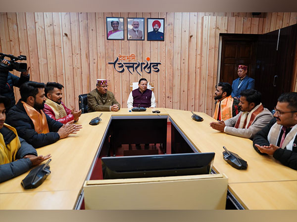 Uttarakhand Chief Minister Pushkar Singh Dhami with young artists of the state. (Photo/ANI)