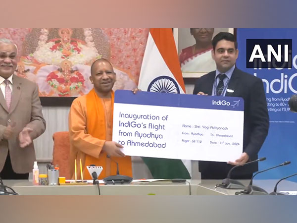 Uttar Pradesh CM Yogi Adityanath receives the boarding pass (Photo/ANI)