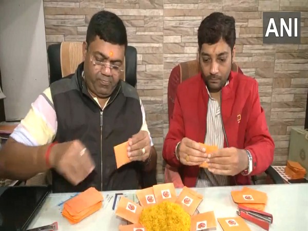 Members of Ram Sharad Smriti Sangh packing yellow rice (Photo/ANI)