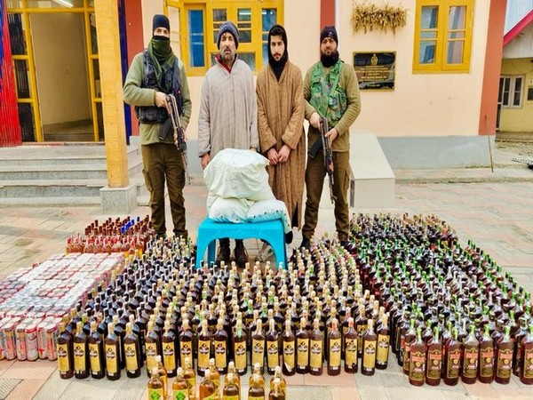 Kashmir police with seized consignment of contraband substance along with two of three arrested persons (photo credit/Anantnag police)