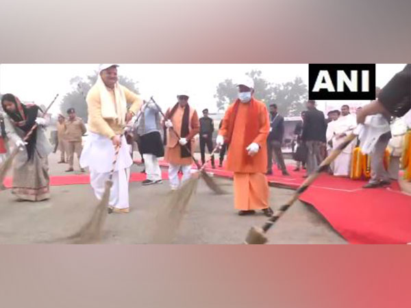 Uttar Pradesh CM Yogi Adityanath participating in a cleanliness drive ahead of the 'Pran Pratishtha' ceremony of the Ram temple in Ayodhya. (Photo/ANI)