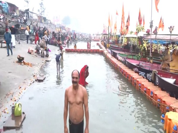 Devotees take holy dip at Saryu Ghat on the occasion of Makar Sankranti in Ayodhya