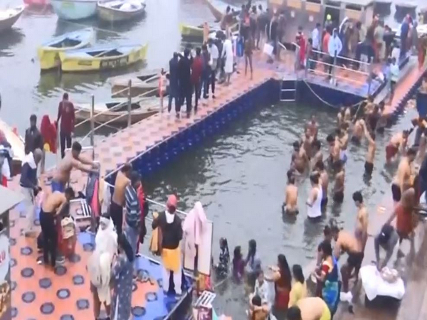 Devotees gather at Ganga Ghat in Varanasi to take a holy dip. (Photo/ANI)