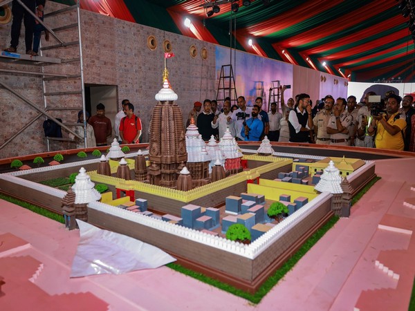 People look at the model of the Srimandir Parikrama project ahead of its inauguration (Photo/ANI)