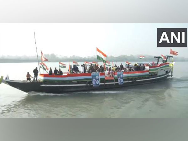 Rahul Gandhi, flanked by Congress leaders and workers, takes a boat ride across the Brahmaputra on Friday. (ANI/Image)