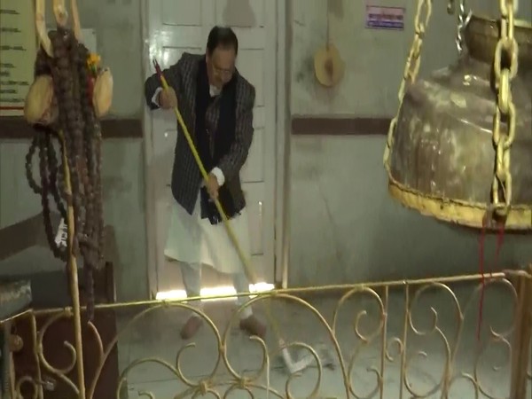 BJP National President JP Nadda cleaning the premises of Delhi's Pashupati Nath Temple (Photo/ANI)